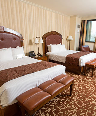 hotel room with two queen beds