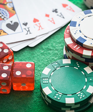 cards, dice and chips laying on a table