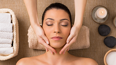woman getting a facial massage in the spa