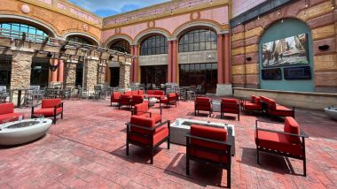 Image of the Courtyard with chairs, fire pits and a big screen tv